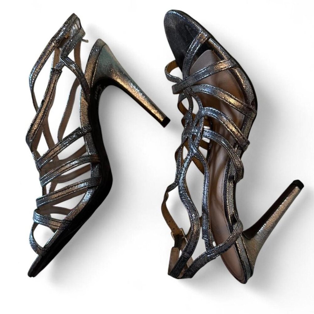 Metallic silver strappy heels with pointed toe and stiletto heel.